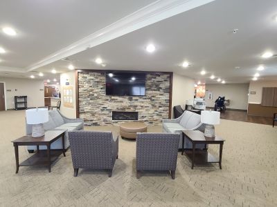 Front room with fireplace and TV